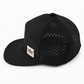 Side view of Graffiti Wear black 7-panel snapback with tan leather patch and laser-perforated back panels