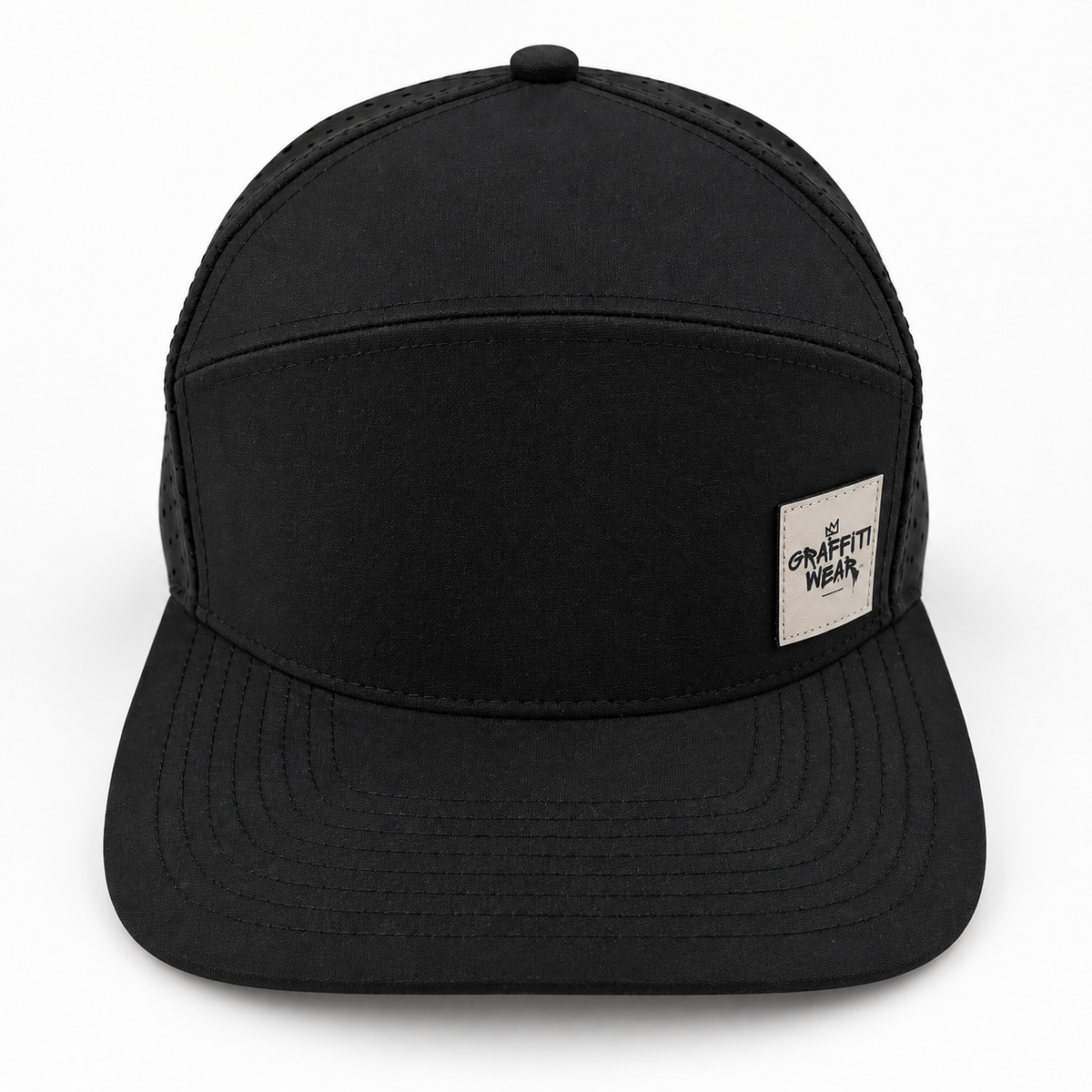 Graffiti Wear all-black 7-panel snapback hat, front view with flat brim and tan leather patch