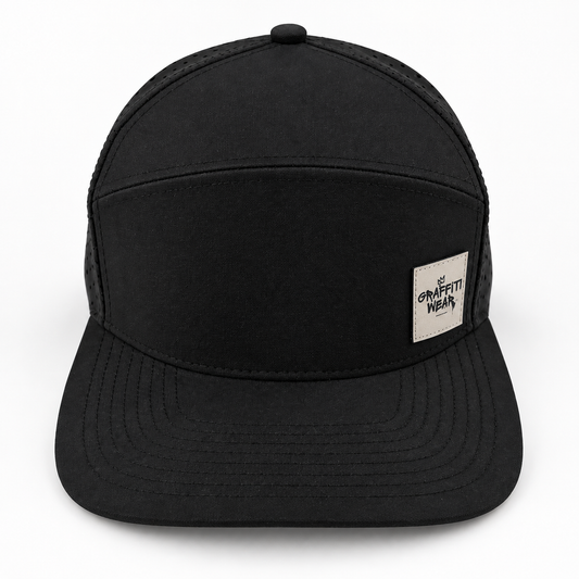 Graffiti Wear all-black 7-panel snapback hat, front view with flat brim and tan leather patch